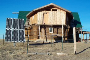 Solar panels complement the wind turbine (not shown) at the Demontiney log house off the grid at Rocky Boy's