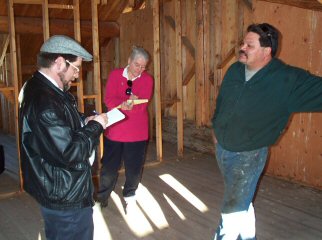 Tim Leeds and Timlynn Babitsky during our visit to Ted Demontiney's off-the-grid log home with its hybrid alternative energy system